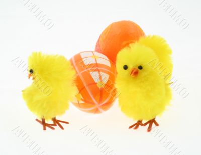 three toy chickens with decorated eggs