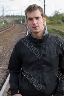 man against tracks