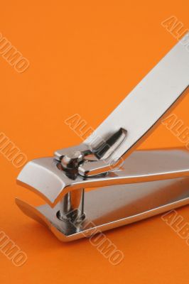 nail clippers on orange