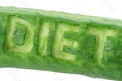 word DIET scraped out in a cucumber