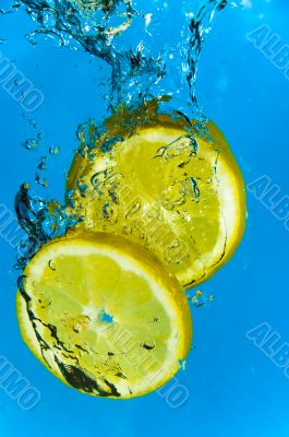 Lemon Fruit Splashing into Citrus Water