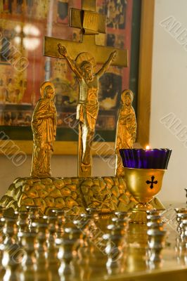 Jesus Christ`s crucifixion. A burning candle.