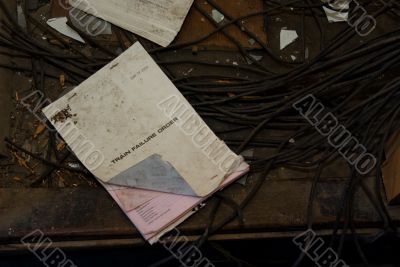 Disused Railway Station: Paperwork and cables Disused Railway Station: Paperwork and cables