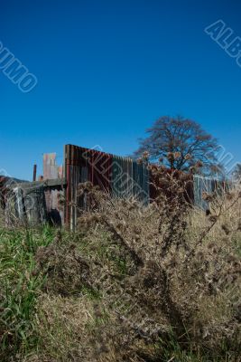 Dilapidated Roadside Corrugated Iron Fence