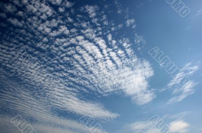 Panorama of blue white cloudy sky wide angle view