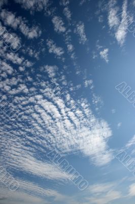 Panorama of blue white cloudy sky wide angle view