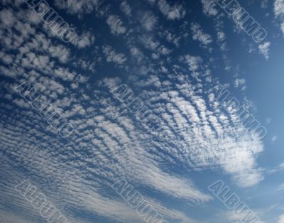 Panorama of blue white cloudy sky wide angle view