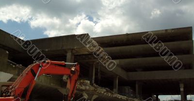 Machine demolishes building