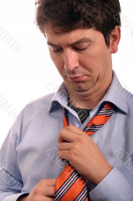 business man fixing tie