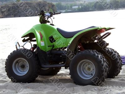 Small All Terrain Vehicle on coast of the river