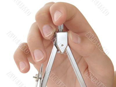hand with compasses