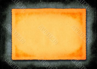 piece of yellowed paper against material background
