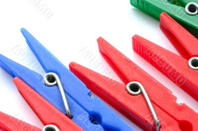 Clothes pegs on white