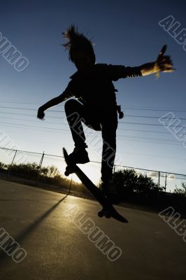 Teenage Skateboarder at Sunset