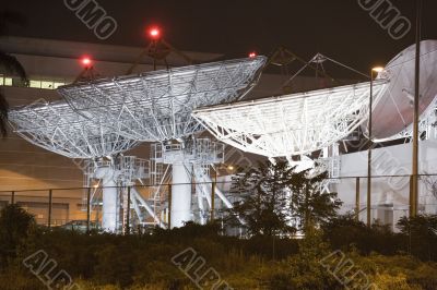 Satellite Communication Dishes at Night