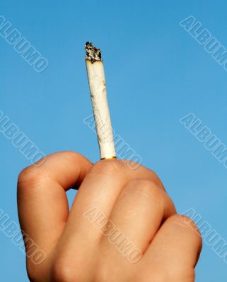 cigarette end in woman hand