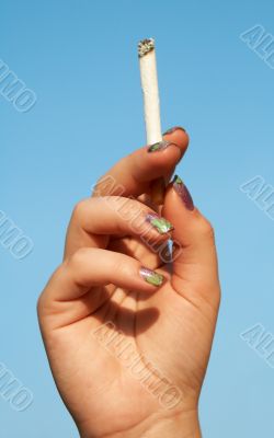 woman hand with cigarette