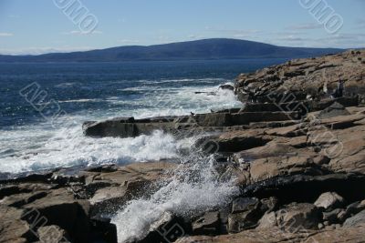 Breaking waves on granite ledges