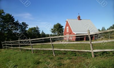 New England red barn and fence