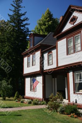 American flag and classic New England House