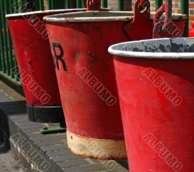Row of red fire buckets