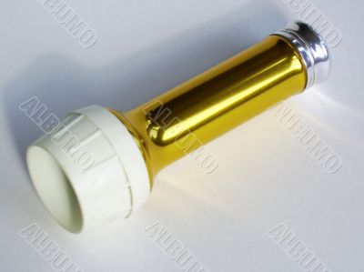 Gold coloured old torch