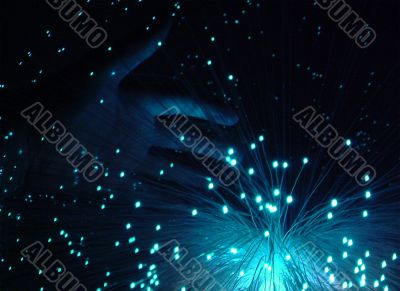 blue hand and fiber optics
