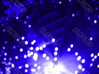 purple blue hand and fibre optics