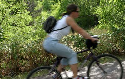 cyclist in motion , focus set in background