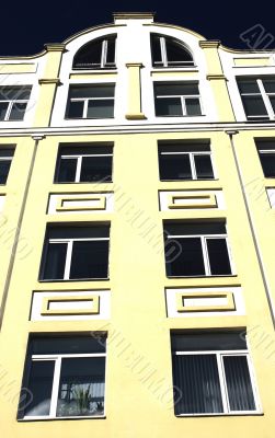 Windows. Dark windows on a light building. Windows. Dark windows on a light building.