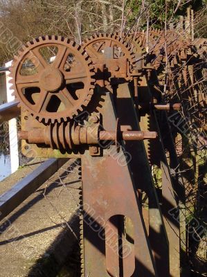 row of rusty olf cogwheels