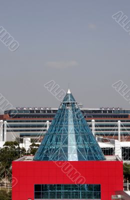 Modern Red Building With Class Cone Roof