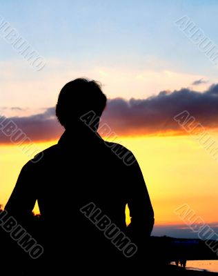 silhouette against summer sunset