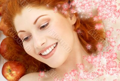 lovely redhead with red apples and flowers