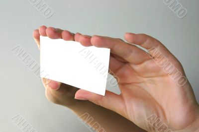 hands holding blank business card
