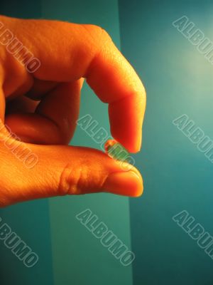 hand and capsule