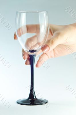 Empty glass in hand