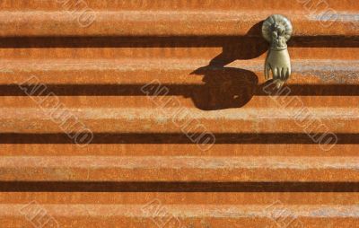 Buddha`s Hand on Corrugated Metal