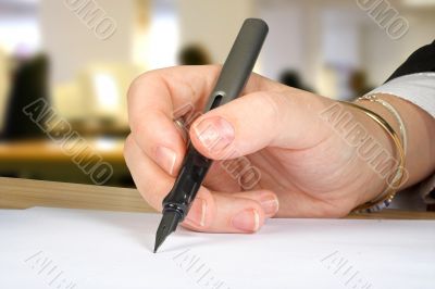 letter signature with office background