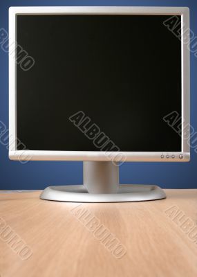 grey monitor on desk