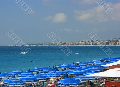 Beach with blue umbrellas 2
