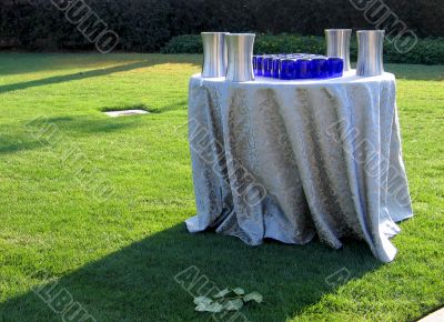 Table with tablecloth and glasses