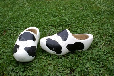 Wooden shoes with cow print.