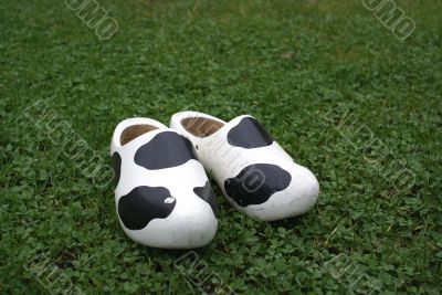 Wooden shoes with cow print.