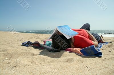 girl sleeping in the beach