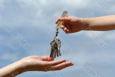 child`s hand with keys