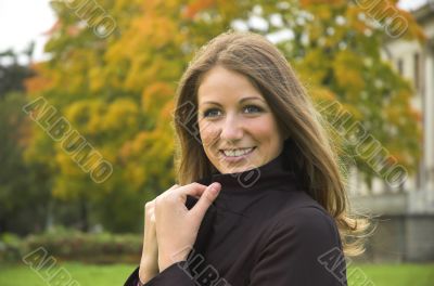Portrait of the beautiful girl in autumn park