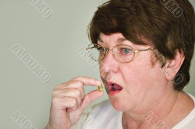 Sick Woman taking a tablet
