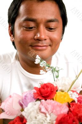 man holds bunch of flowers