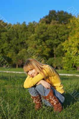 squatting at meadow